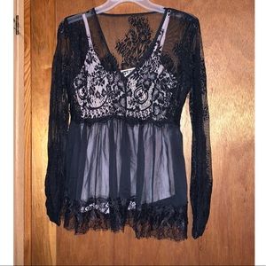 Black blouse with light pink tank top.